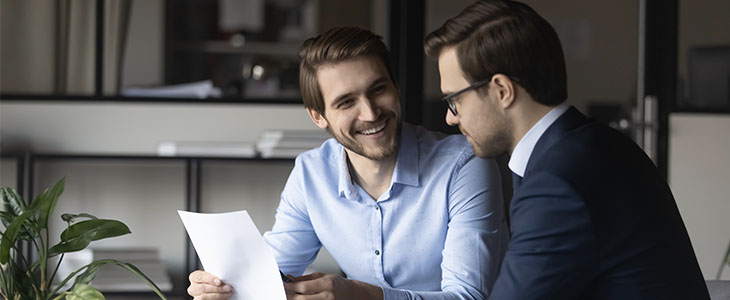 two men in suits discussing representing institutional ad retail