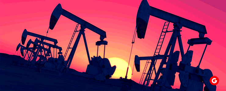 Oil pumps silhouetted against a vibrant sunset, symbolizing the energy industry's role in harnessing natural resources.