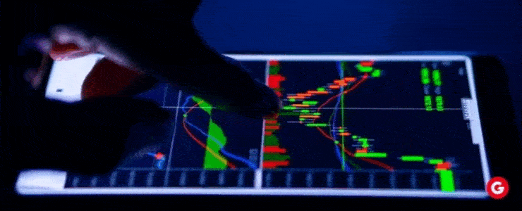 Individual engaged with a tablet displaying a stock market chart, highlighting investment trends and data analysis.