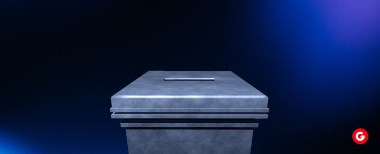 A metal box featuring a blue light on top, set against a neutral background.